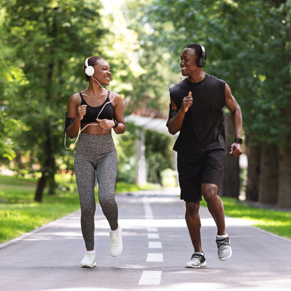 Couple jogging along a path